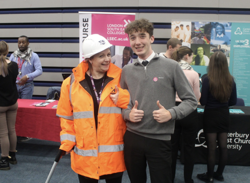 A photo taken of a staff member and student at the Leigh Academy Longfield Careers Fair 2024.