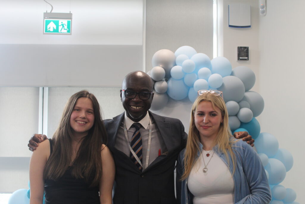 Students stood with Principal Donkor